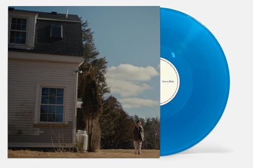 Vinyl record with blue tint, album cover showing a house and person.