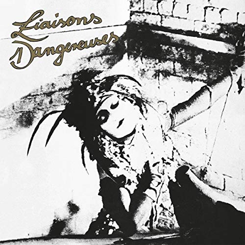 Black and white vinyl album cover with ornate title and reclining figure.