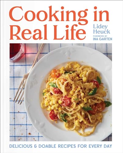 Cookbook cover with pasta dish, titled “Cooking in Real Life.”