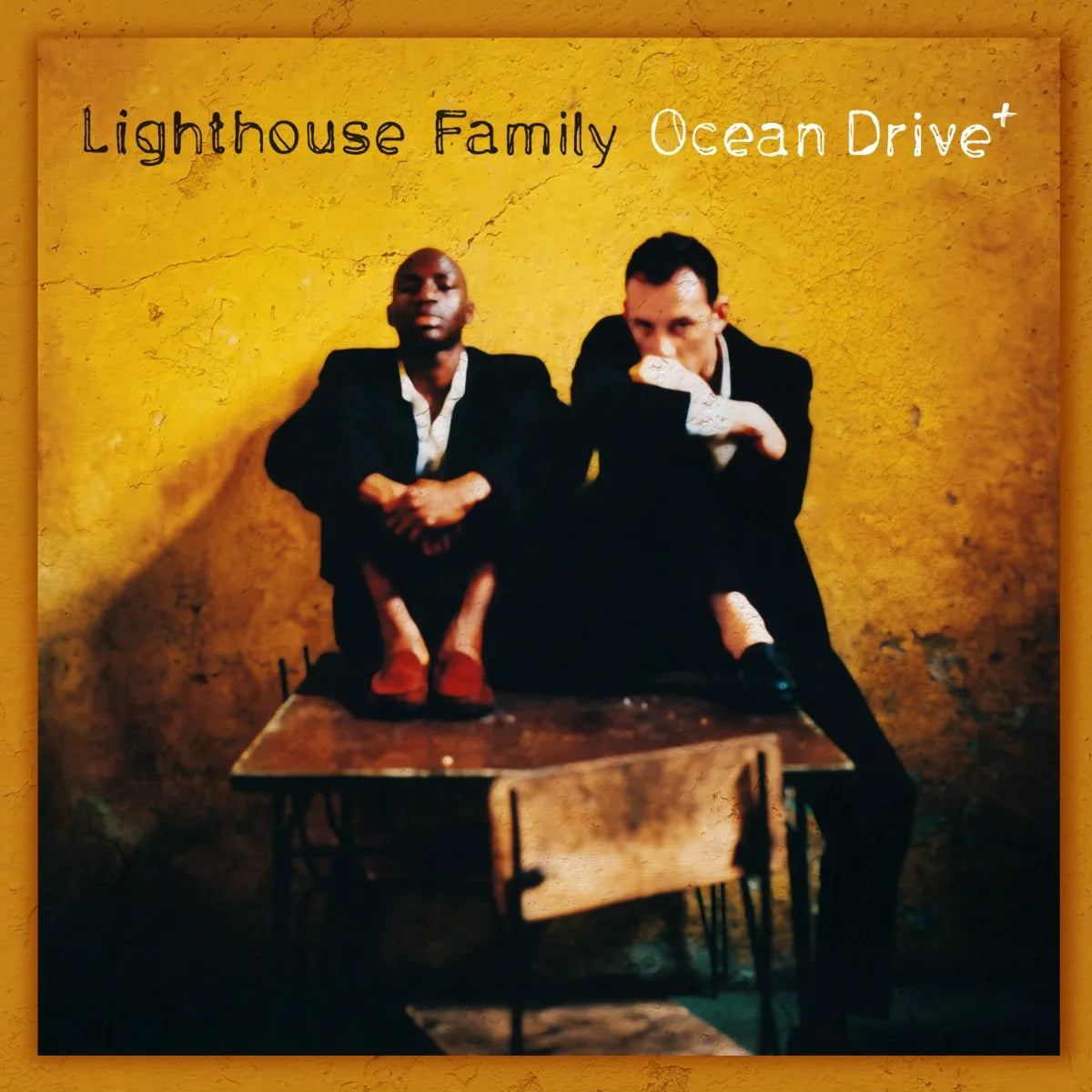 Lighthouse Family album cover: two men seated on a school desk.