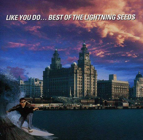 "Album cover with surfer and city skyline, 'LIKE YOU DO... BEST OF THE LIGHTNING SEEDS' text."