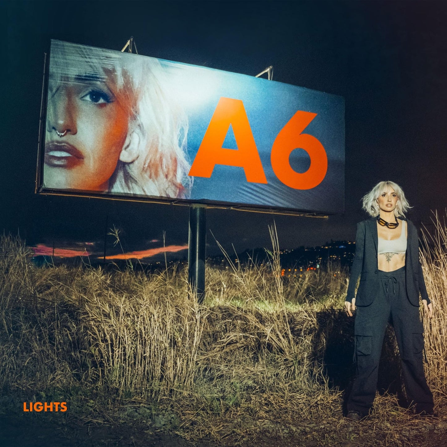 CD cover for “Lights - A6” featuring a woman and billboard.