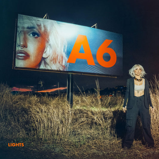 CD cover for “Lights - A6” featuring a woman and billboard.