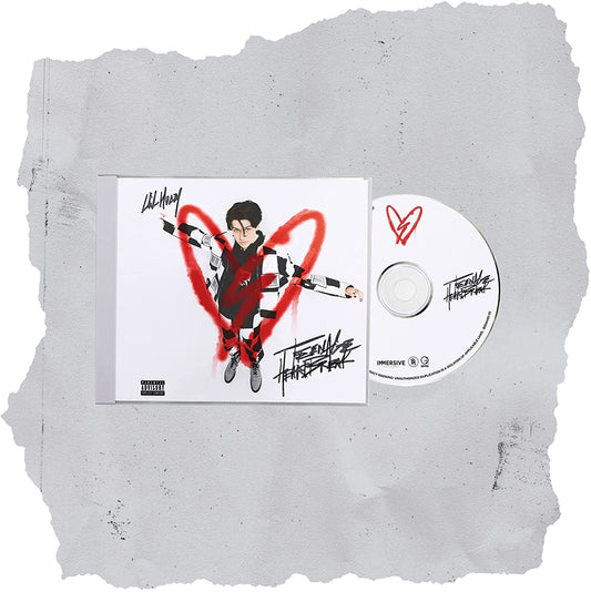 CD case and disc with cartoon man and red heart on grey stone background.