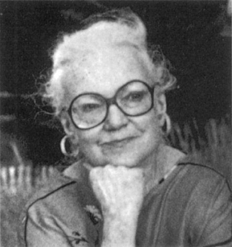 Black and white portrait of Lilian Jackson Braun with large glasses.