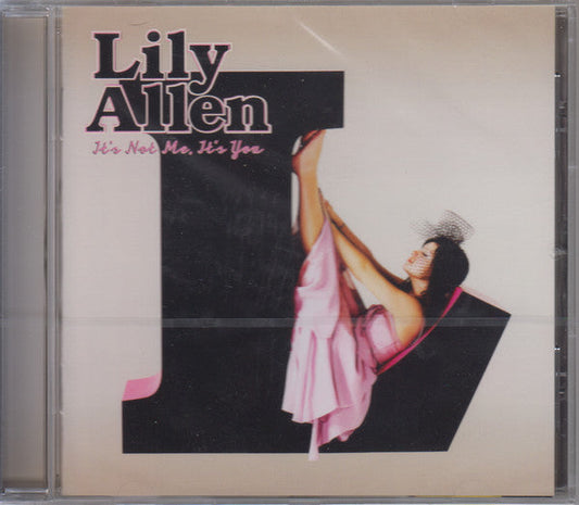 Lily Allen CD cover featuring the artist in a pink dress against a large letter.