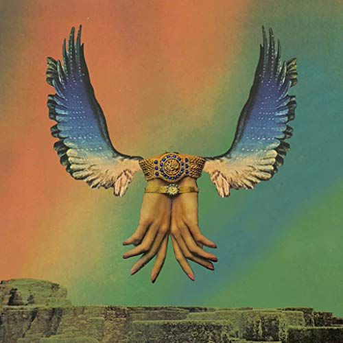 Surreal album cover with winged hands and a pyramid background.
