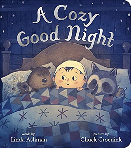 Child in bed with woodland animals under a blue star-patterned quilt.