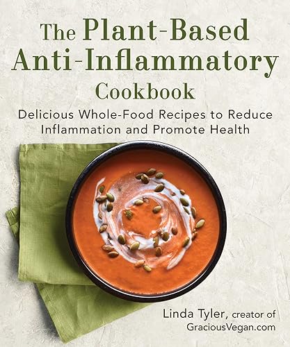 Cookbook cover with a bowl of orange soup and green napkin.