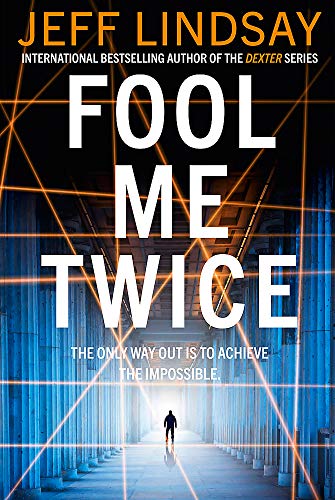 Book cover: "Fool Me Twice" with a lone figure in a concrete corridor.