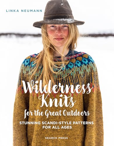 A woman with blonde hair wearing a hat and a patterned sweater in snow.