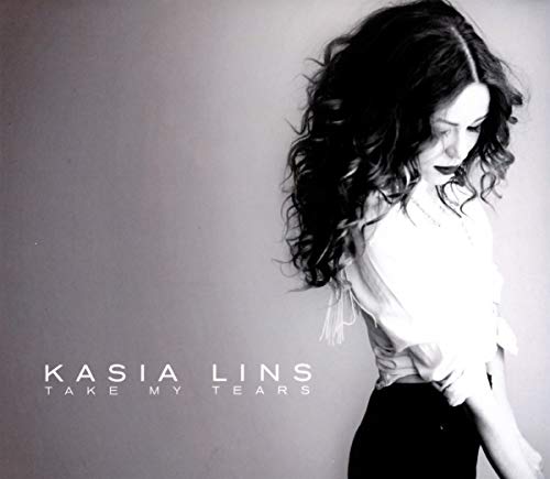 Black and white CD cover featuring a woman with long, dark hair.