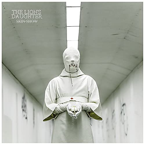 Album cover: hooded figure in white robe holding a skull.