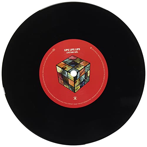 Black vinyl record with a red label featuring a Rubik’s Cube image.