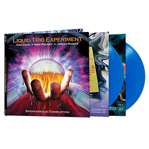 Liquid Trio Experiment vinyl record set with blue discs and illustrated gatefold cover.