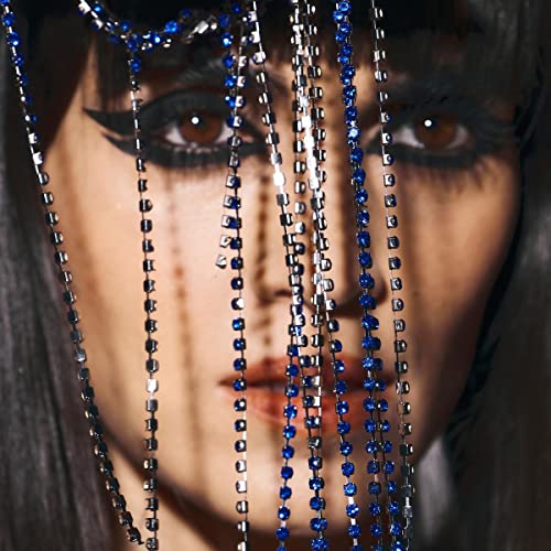 Close-up of a woman with dark hair and beaded strands across her face.