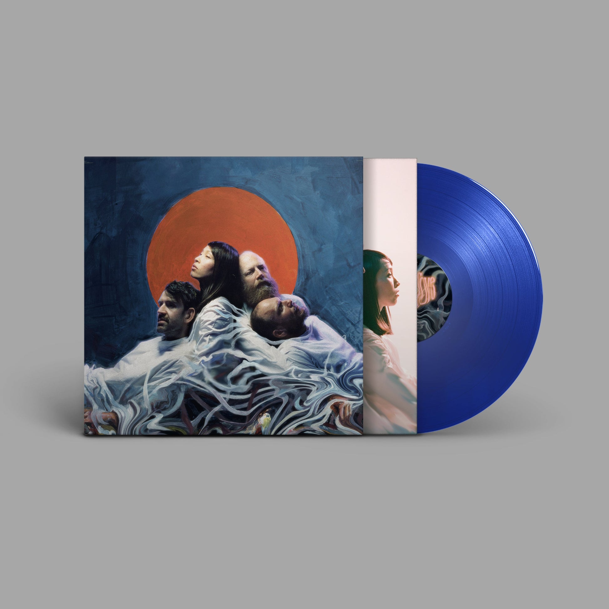 Vinyl record and album cover featuring a group of people and a red sun.