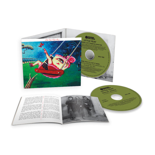 "CD case with album cover, two green CDs, and open booklet on white background."