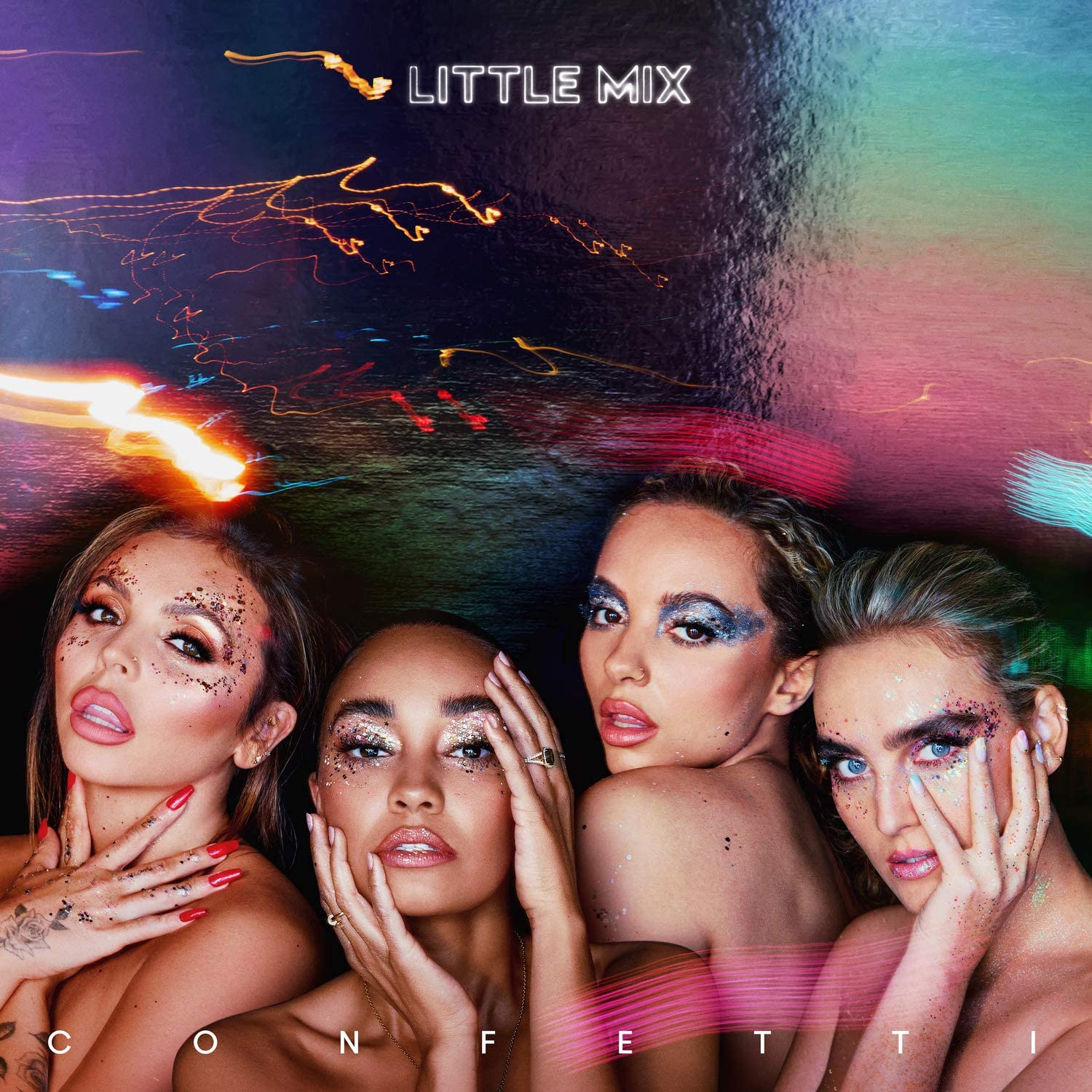 "Album cover featuring four women with painted faces against a colorful, abstract background."