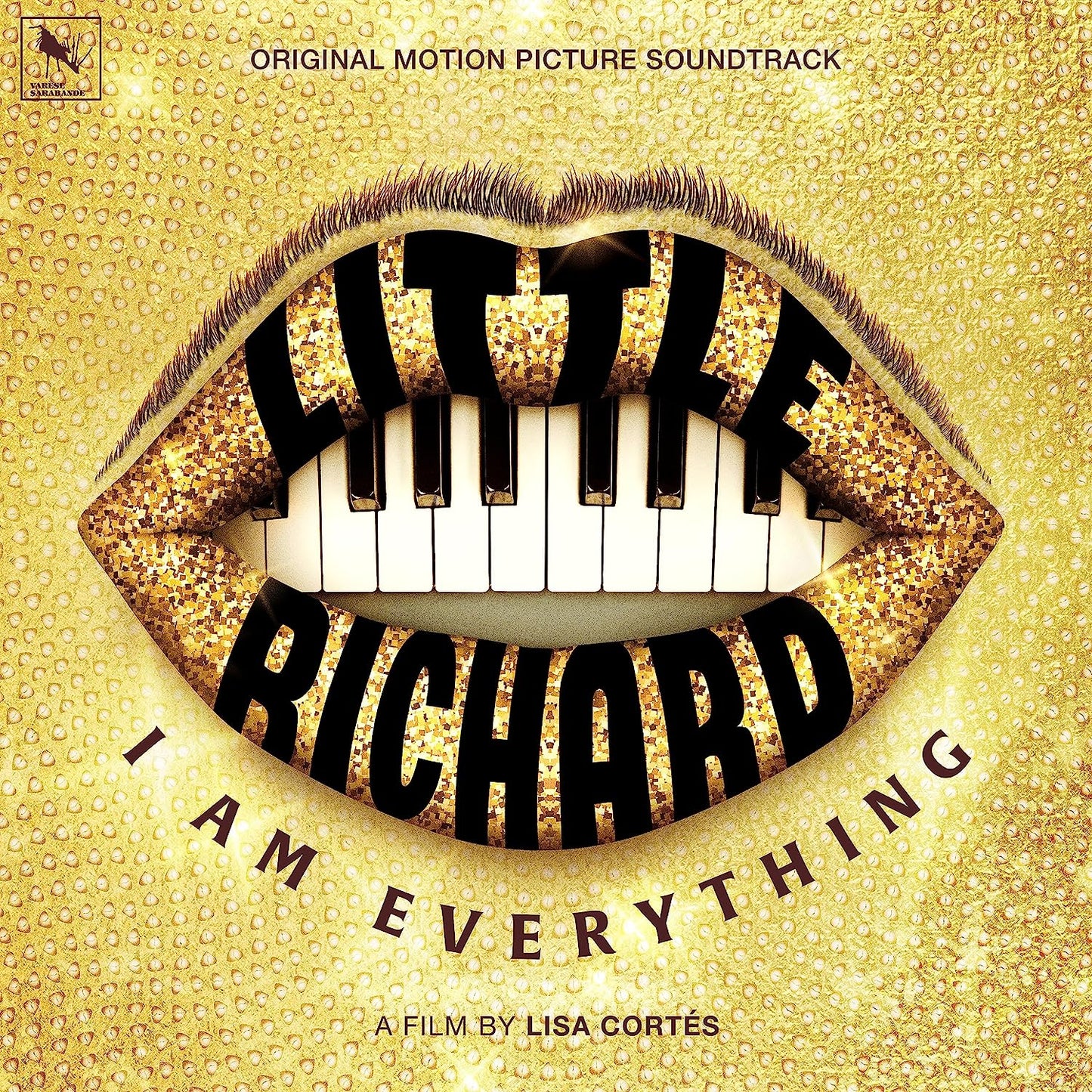 "Album cover with gold background, piano keys between lips, and 'LITTLE RICHARD' in bold letters."
