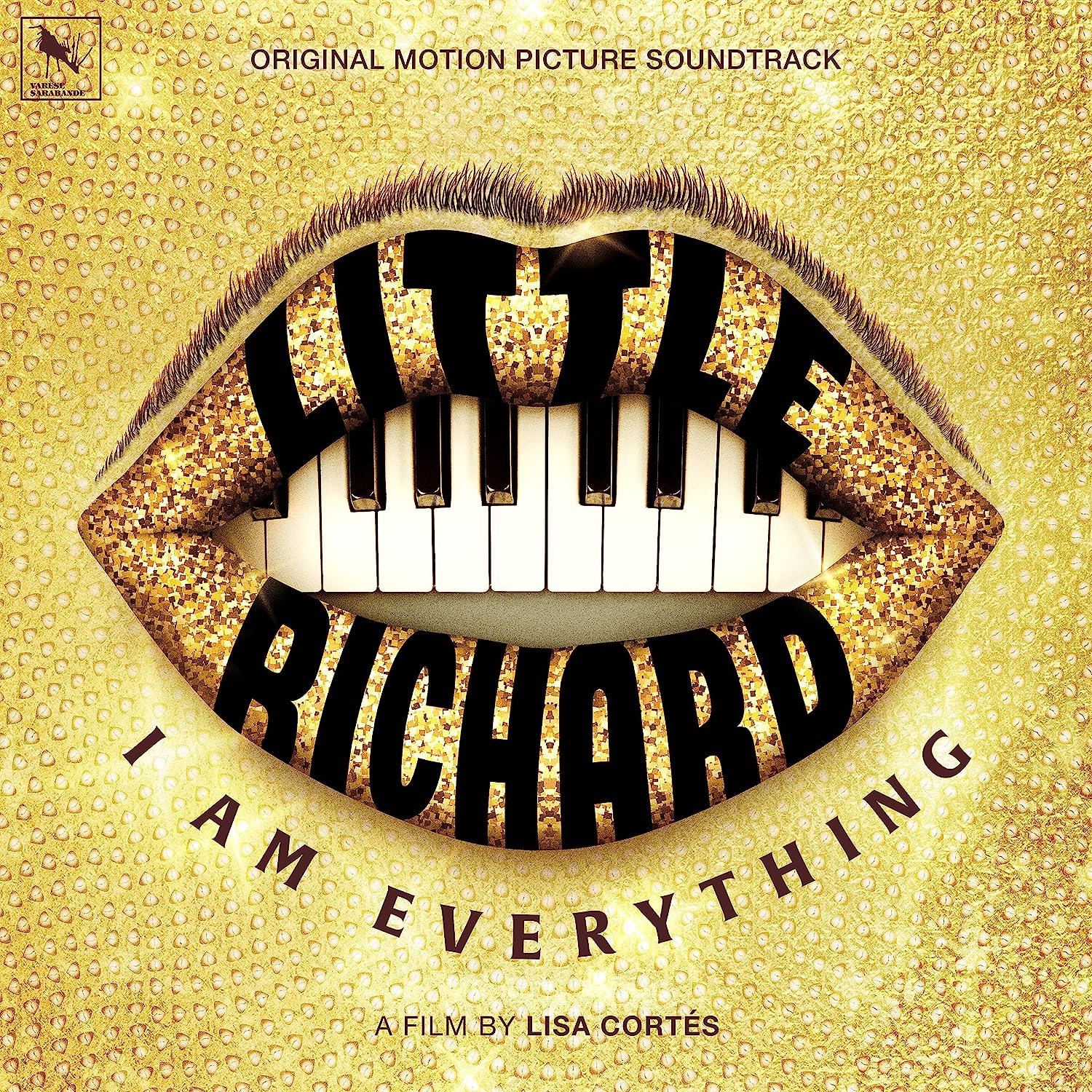"Album cover with gold background, piano keys between lips, and 'LITTLE RICHARD' in bold letters."