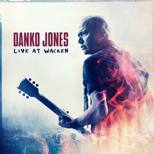 Blu-ray cover of Danko Jones Live At Wacken featuring a guitarist with fire effects.