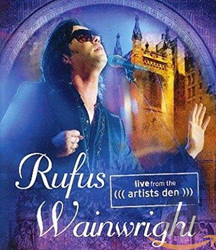 Rufus Wainwright singing into a microphone with a castle backdrop.