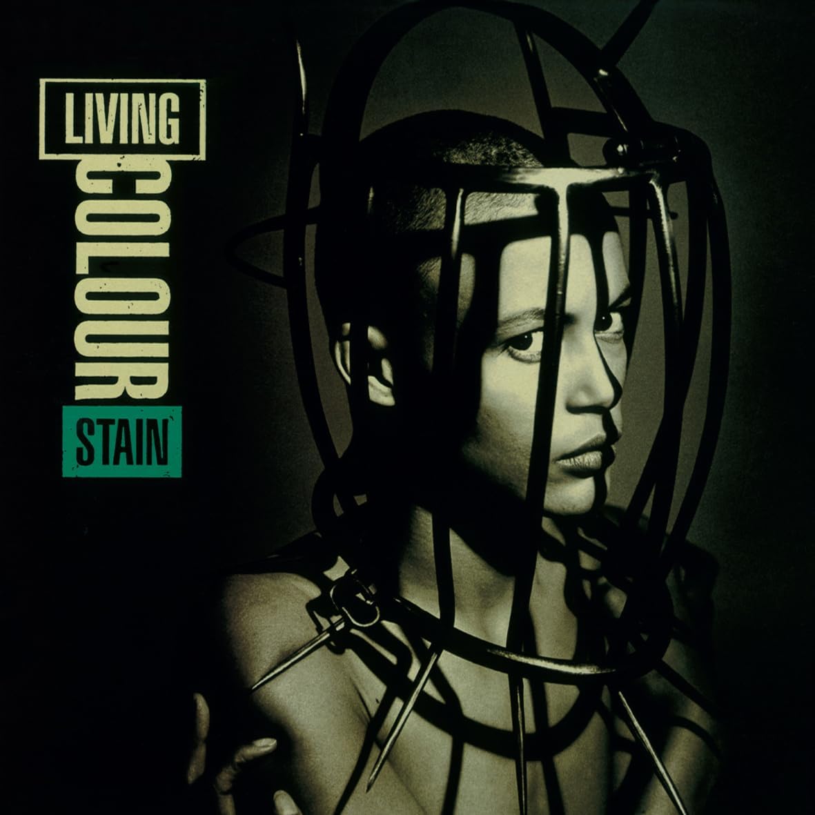 Black and white album cover for Living Colour’s “Stain” with a caged face.