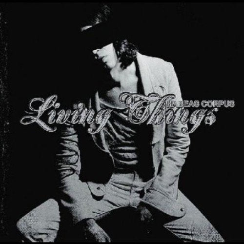 Black and white album cover with a man in a suit and hat.