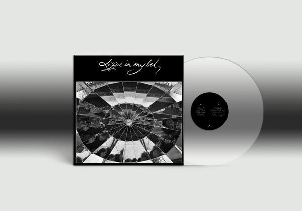 Black and white vinyl record with a circular, mirrored image cover.