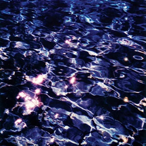 Abstract water surface with light reflections, dark blue and purple tones.
