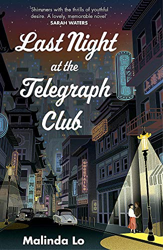 BookHoused in a night city street, two people stand under a glowing streetlamp.