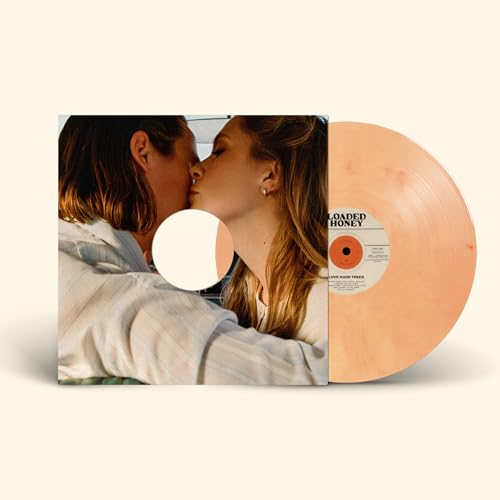 Vinyl record with peach coloring and album cover featuring a couple kissing.