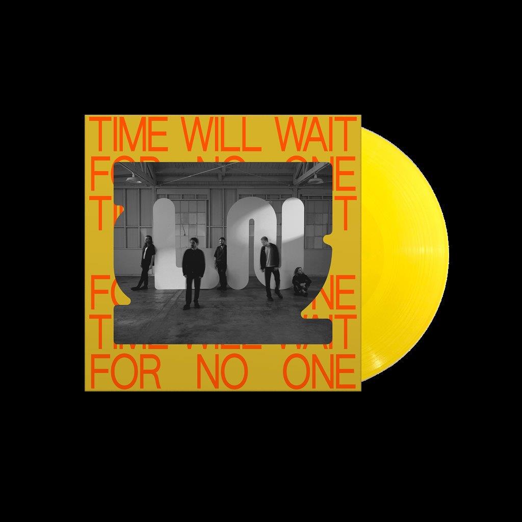 Yellow vinyl record with album cover featuring a black-and-white band photo and orange text.