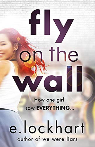 Book cover featuring a smiling girl with red hair against a brick wall background.
