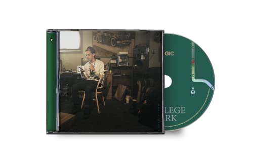CD case with a man writing and a green disc visible.