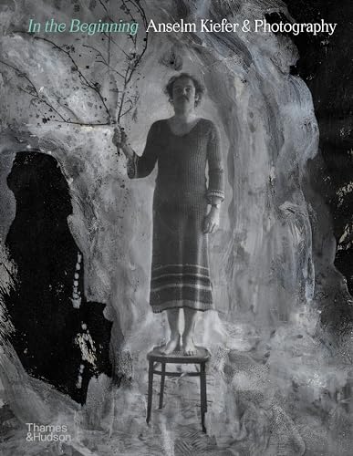 Book cover: woman on stool in a textured, grayscale landscape.
