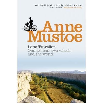 Book cover: cyclist overlooking a valley, title “Lone Traveller” by Anne Mustoe.