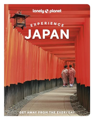 Book cover showing two people walking through a path of red Japanese torii gates.