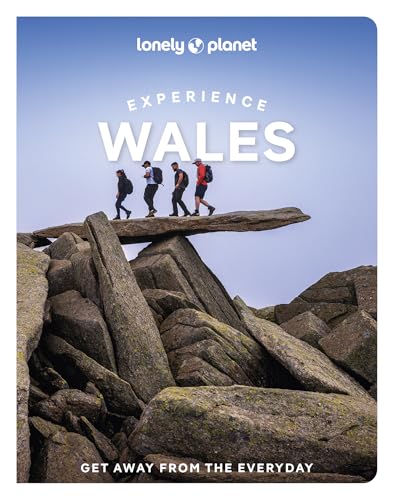 Lonely Planet “Experience Wales” guidebook cover with hikers on a rocky ridge.