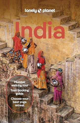Four women in traditional Indian clothing carry metal pots down stone steps.