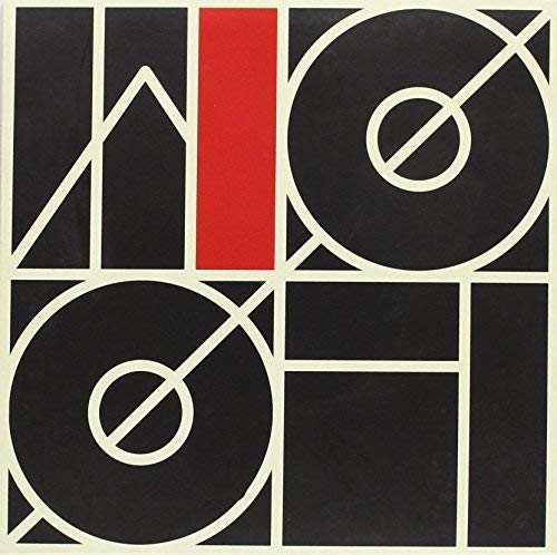 Black and white album cover with red vertical stripe and circular designs.
