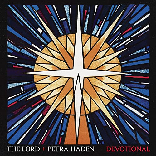 Vinyl record cover: stained-glass starburst design with artist and title text.