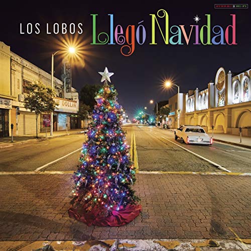 Los Lobos" Christmas CD cover with a brightly lit tree in a city street.