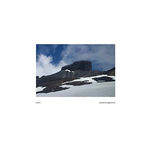 CD cover with a snowy mountain range under a blue sky.
