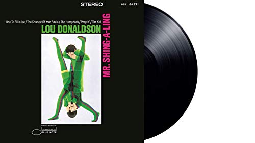 Lou Donaldson album cover with a man dancing, and a vinyl record.