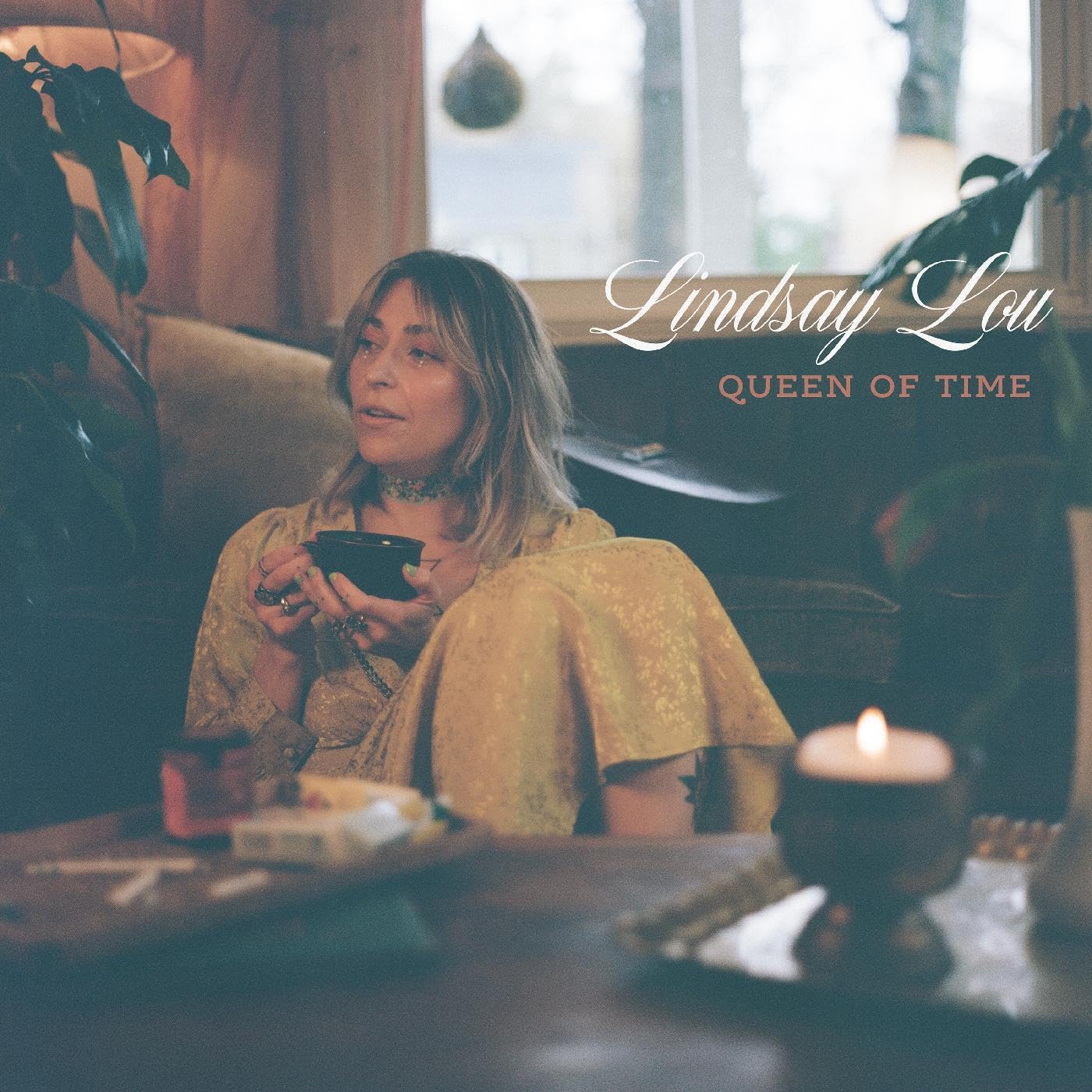 Album cover for Lindsay Lou’s “Queen Of Time” featuring a portrait of the artist.