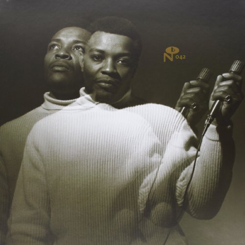 Black and white portrait of Lou Ragland holding a microphone, vinyl record cover.