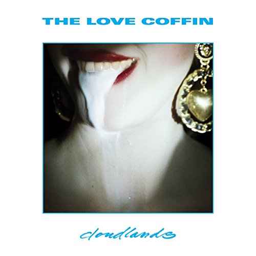 Album cover for The Love Coffin, featuring a close-up of a smiling mouth.