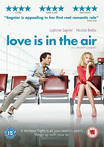A man and a woman sit in airport chairs on the Love Is In The Air DVD cover.